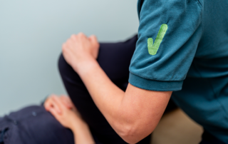 Physiotherapist testing flexibility