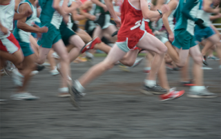 Runners running fast with motion blur