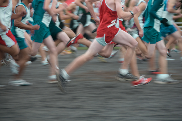 Runners running fast with motion blur