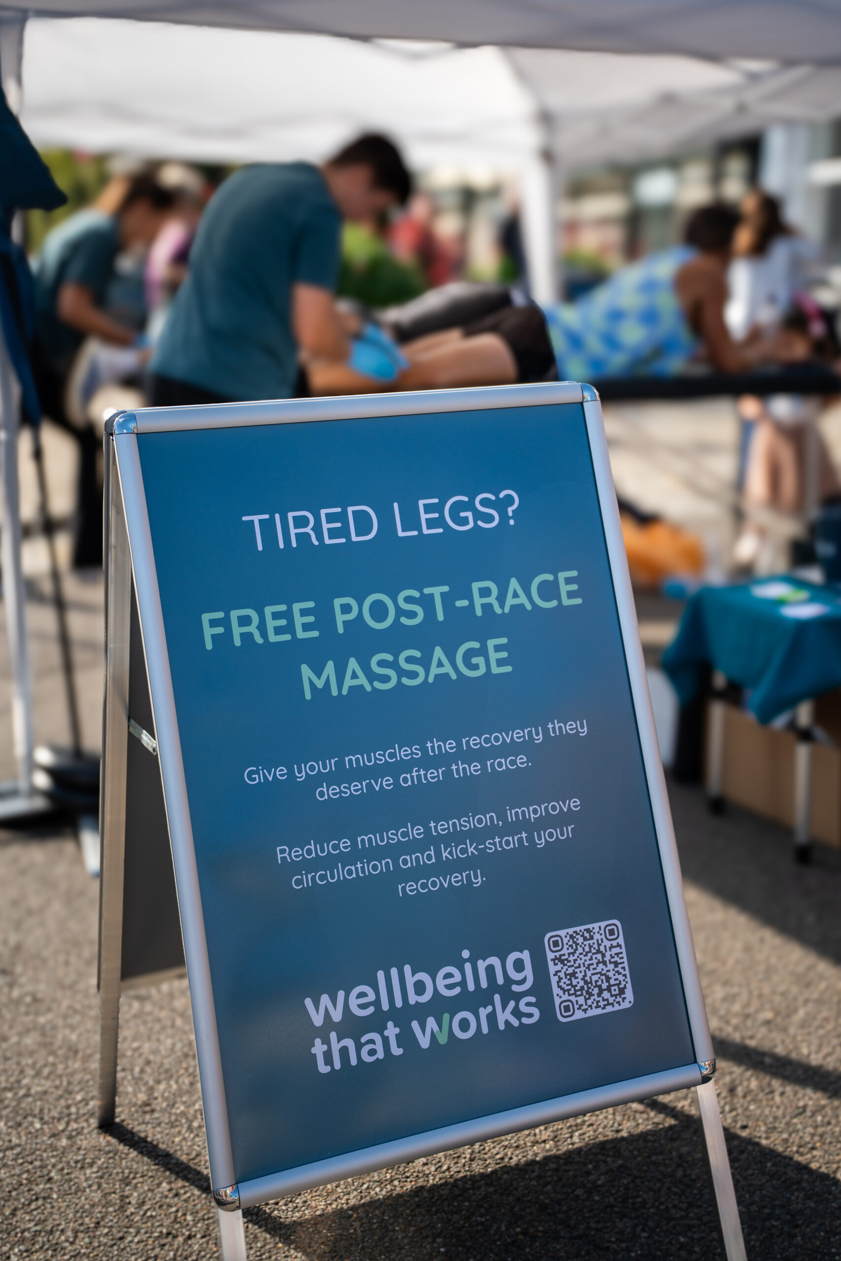 St Nicholas’ 10K Bury St Edmunds: Supporting Local Runners and Community Wellbeing Sign advertising free post-race massage at the St Nicholas' 10K event.