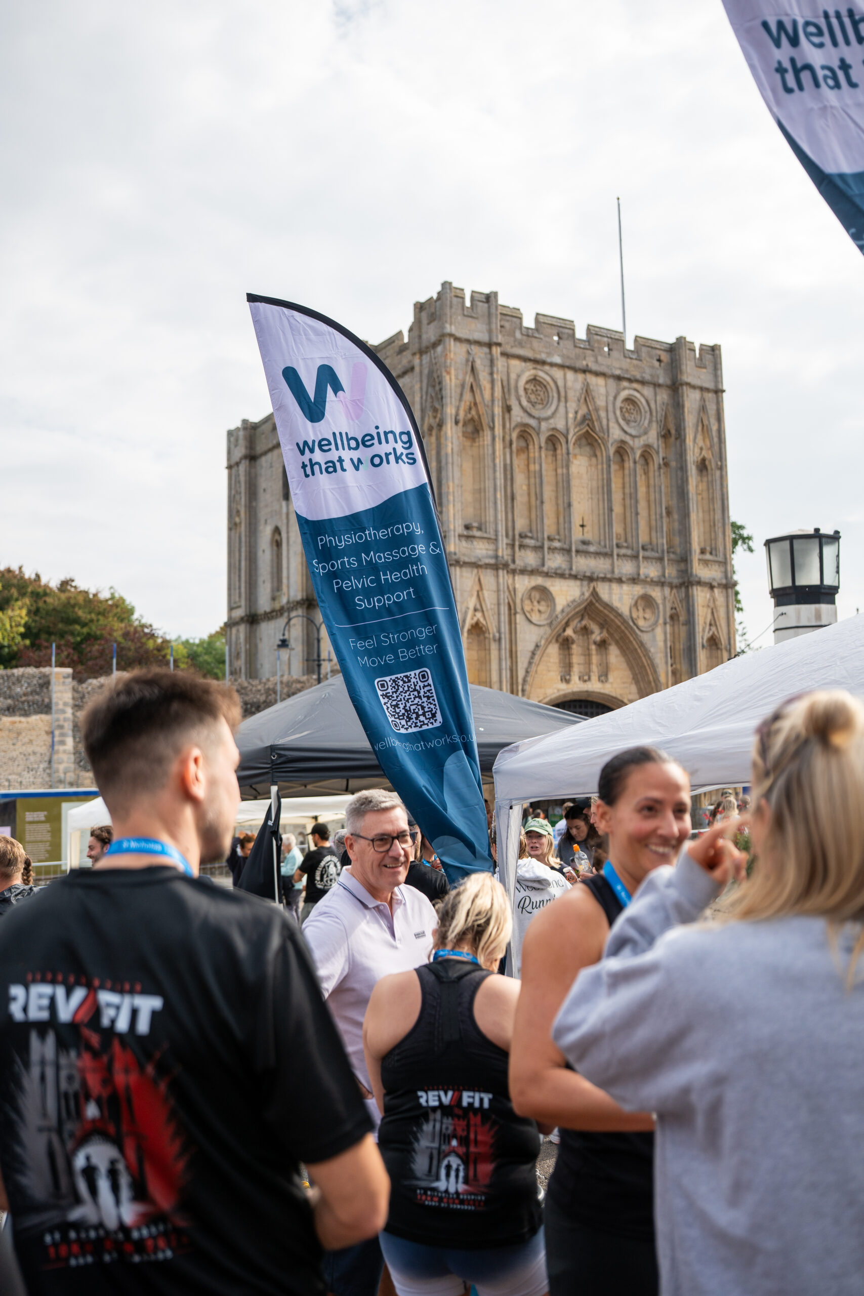 St Nicholas’ 10K Bury St Edmunds: Supporting Local Runners and Community Wellbeing Visitors and runners gathered around wellbeing and recovery stands at the event.